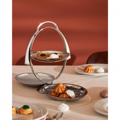  Alessi - Modello: Anna Gong - Design By: Alessandro Mendini - Alzata pieghevole in acciaio cromato dal design moderno e dalle linee eleganti - Colore: Acciaio - SKU: AM37 - Codice EAN: 8003299324767 