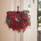 Decorazione per porte con ghirlanda con bacche rosse